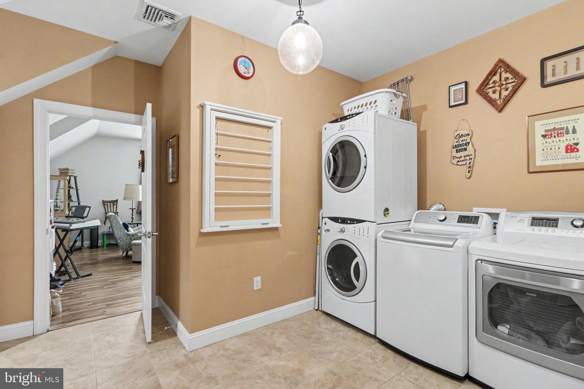 1080 Swatara Road Hershey, PA 17033 - Photo 41 of 59 a view of washer and dryer with kitchen in the background