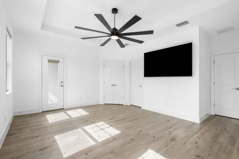 a view of livingroom with hardwood floor and a ceiling fan