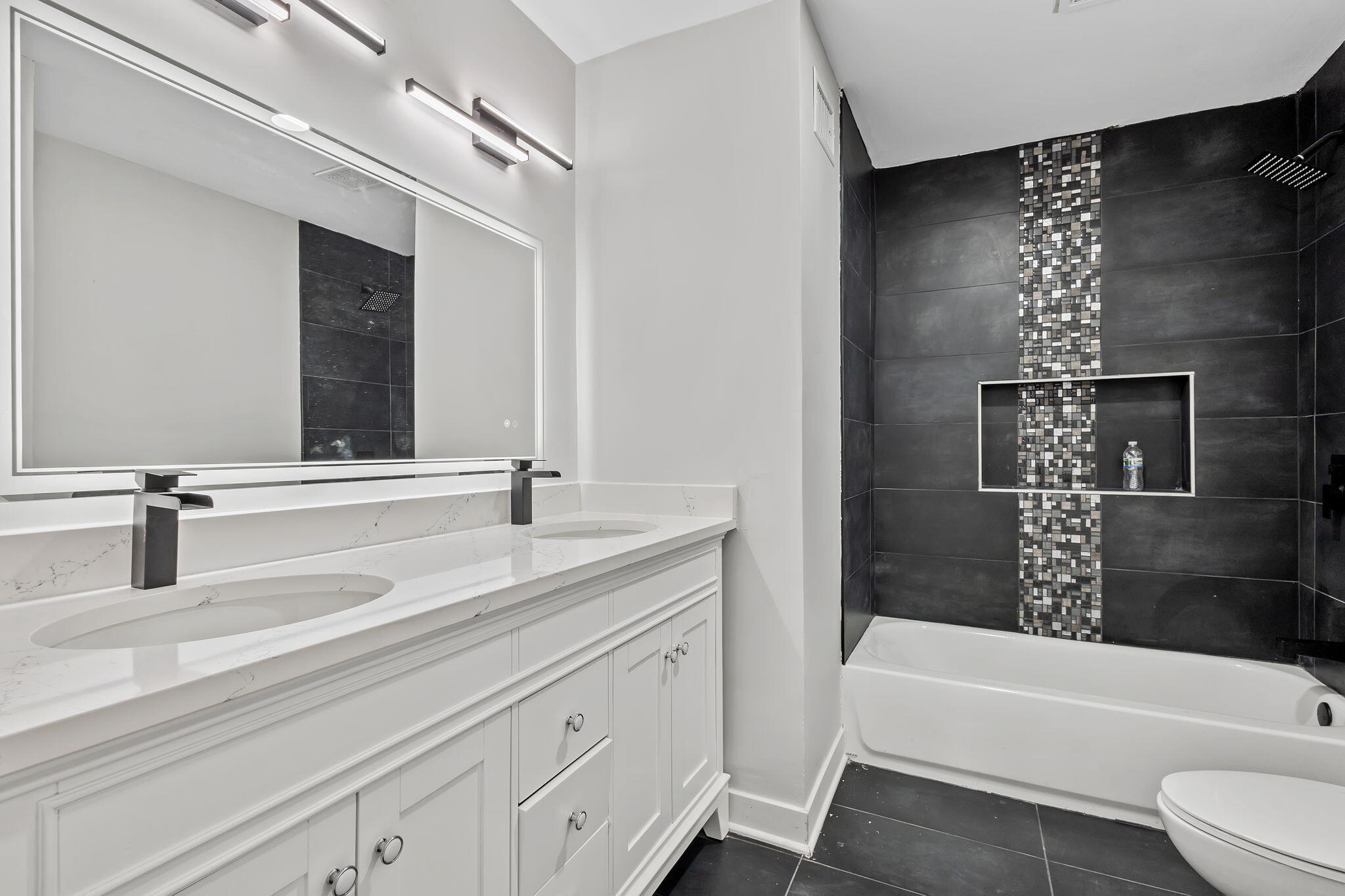 2368 Wheeler Street Gary, IN 46406 - Photo 9 of 16 a bathroom with a tub sink and mirror
