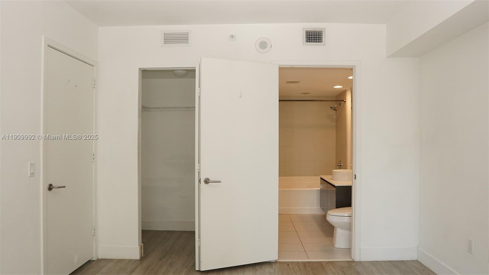 31 Southeast 6th Street, Unit 1108 Miami, FL 33131 - Photo 18 of 22 a bathroom with a toilet and a sink