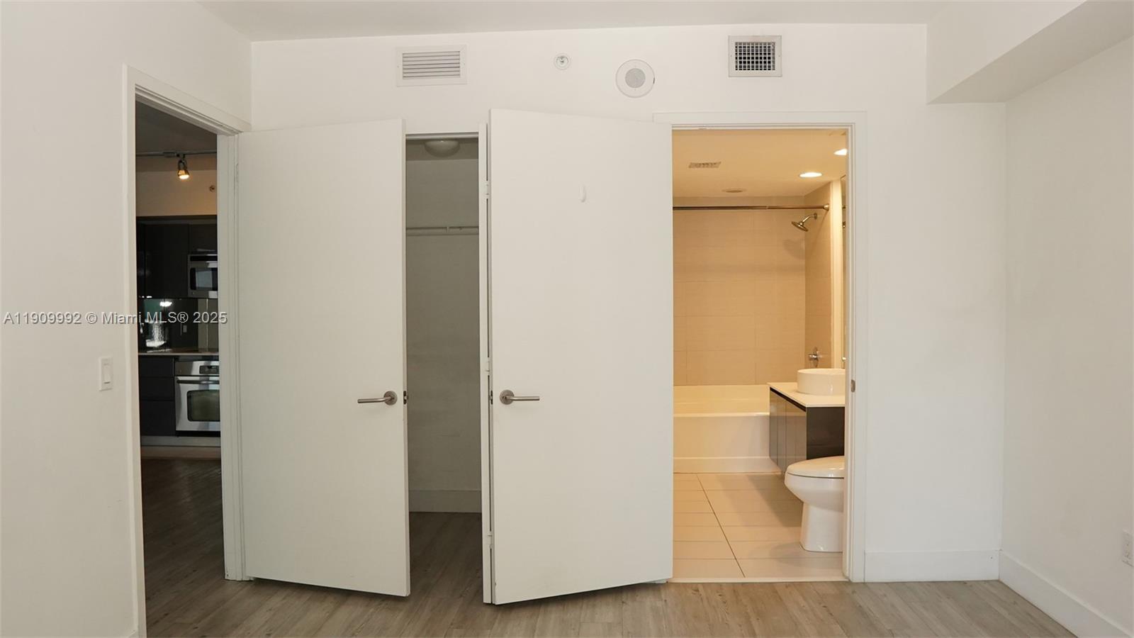 31 Southeast 6th Street, Unit 1108 Miami, FL 33131 - Photo 19 of 22 a bathroom with a toilet