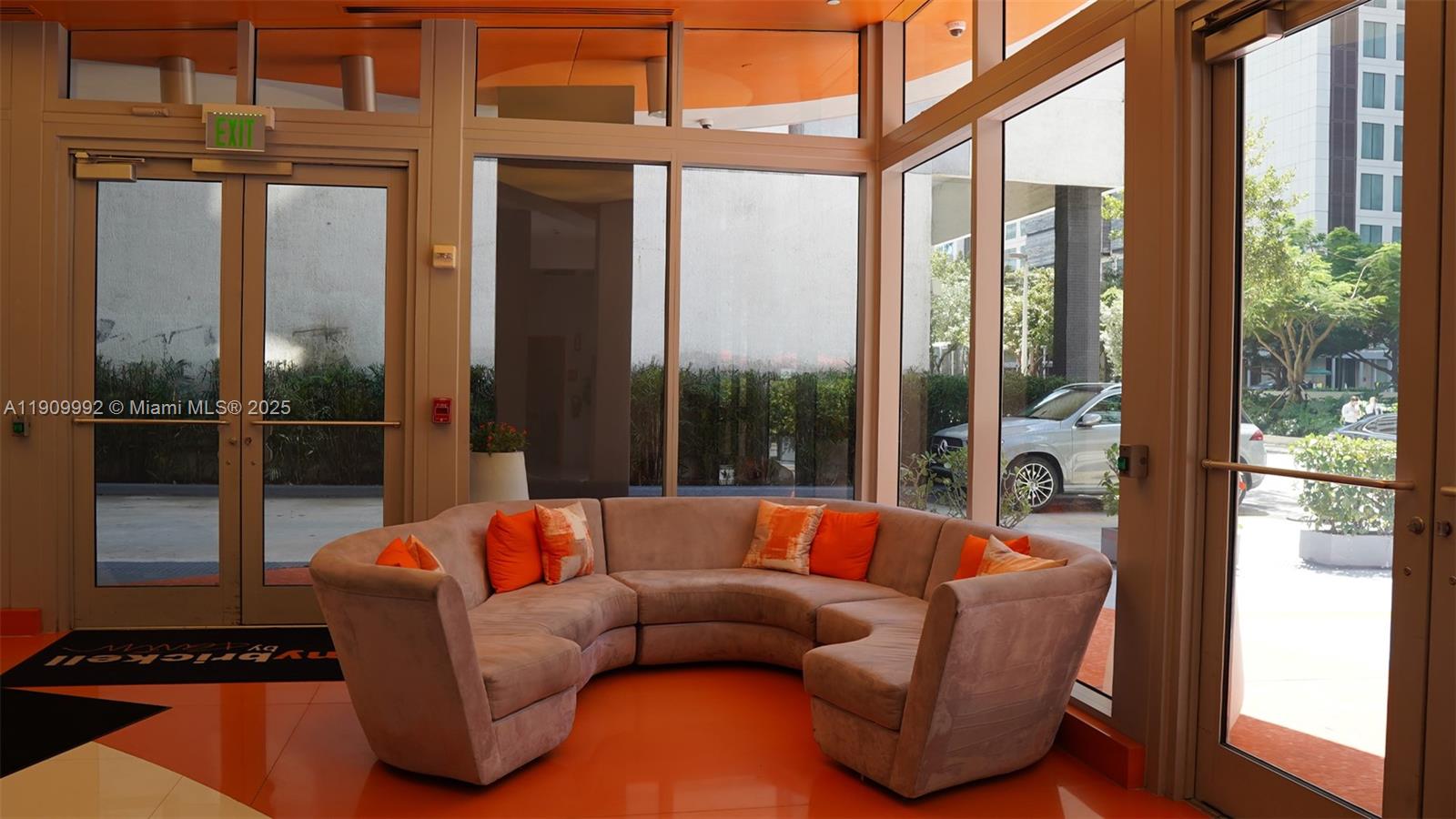 31 Southeast 6th Street, Unit 1108 Miami, FL 33131 - Photo 22 of 22 a living room with furniture a floor to ceiling window and a floor to ceiling window