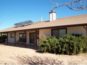 2510 North Reed Road Chino Valley, AZ 86323 - Photo 2 of 8 a view of a house with a yard