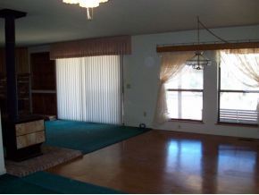 2510 North Reed Road Chino Valley, AZ 86323 - Photo 5 of 8 a view of an empty room with wooden floor and a window