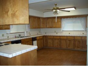 2510 North Reed Road Chino Valley, AZ 86323 - Photo 6 of 8 a kitchen with granite countertop a sink a stove and cabinets