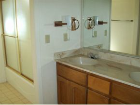 2510 North Reed Road Chino Valley, AZ 86323 - Photo 8 of 8 a bathroom with a granite countertop sink a mirror and shower
