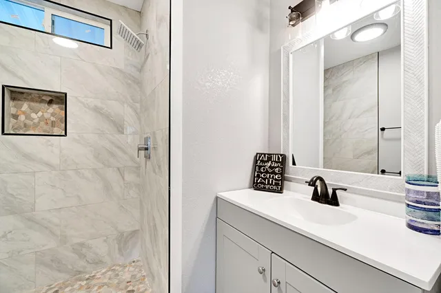 a bathroom with a sink and a mirror