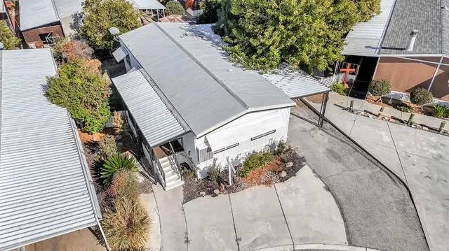 an aerial view of a house with a garden