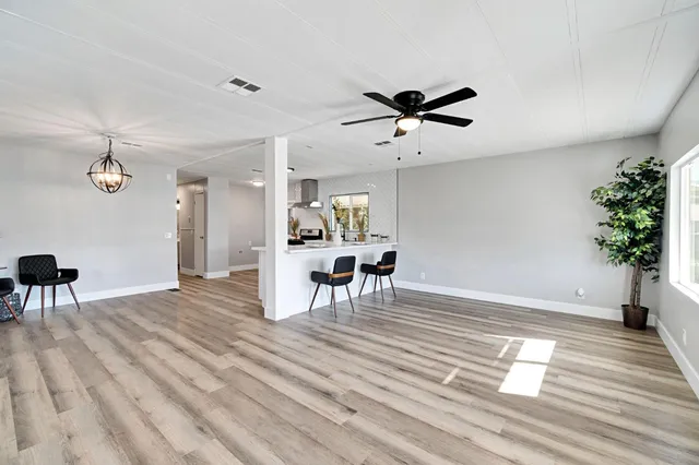 a view of a livingroom with furniture and wooden floor