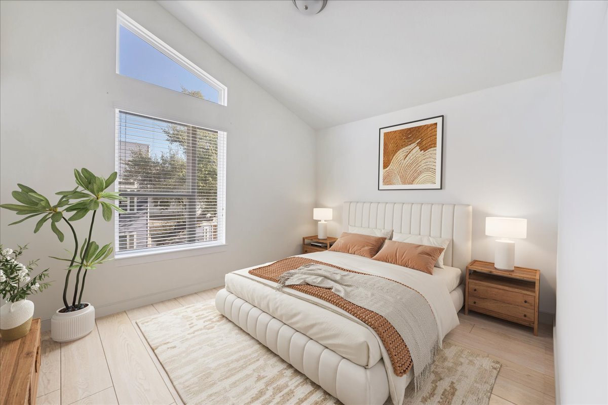 8922 Manchaca Road, Unit 906 Austin, TX 78748 - Photo 6 of 29 a bedroom with a bed and a potted plant