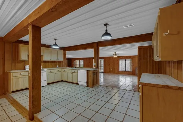 a kitchen with a refrigerator and a sink