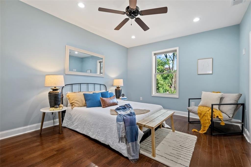 5531 Columbo Street Pittsburgh, PA 15206 - Photo 15 of 34 a bedroom with a bed and wooden floor