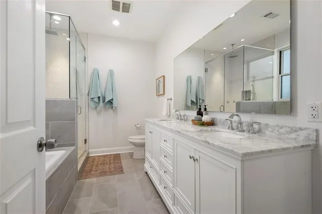 a bathroom with a shower and a toilet