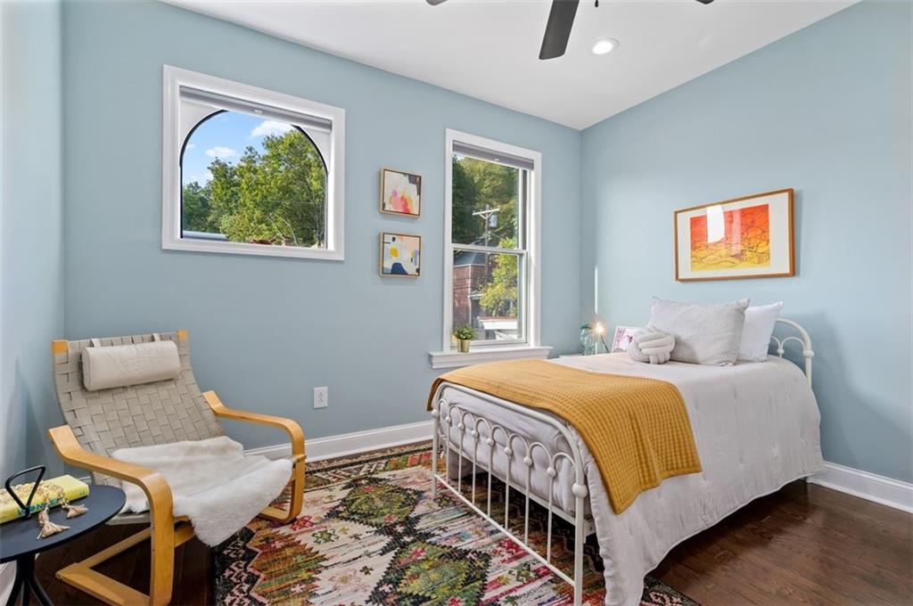 5531 Columbo Street Pittsburgh, PA 15206 - Photo 20 of 34 a bedroom with a bed and wooden floor