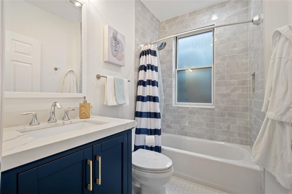 5531 Columbo Street Pittsburgh, PA 15206 - Photo 22 of 34 a bathroom with a sink toilet tub and shower