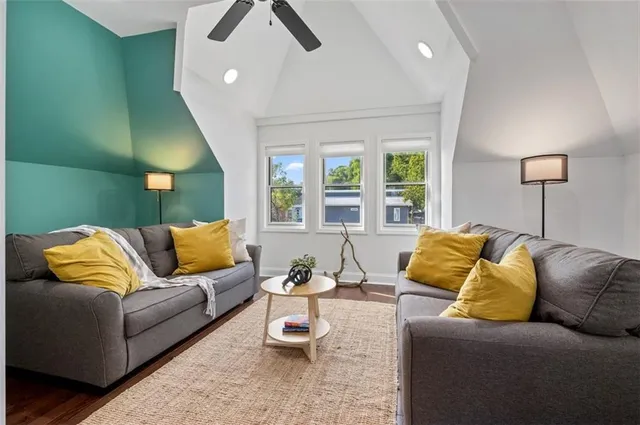 a living room with a couch and a window