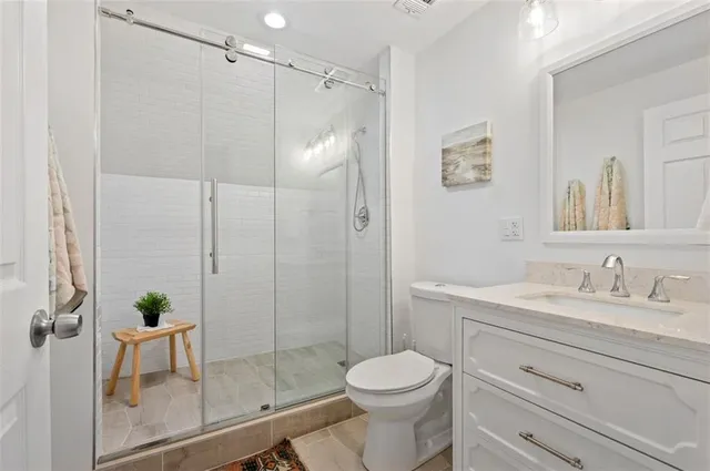 a view of a roof deck with table and chairs with wooden floor