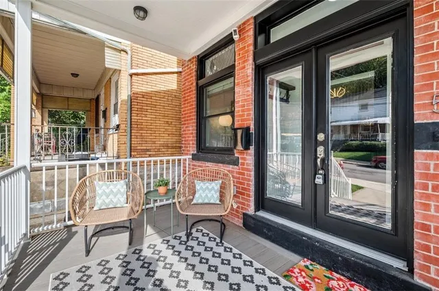 a view of an entryway with wooden floor