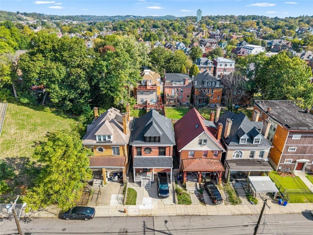 5531 Columbo Street Pittsburgh, PA 15206 - Photo 32 of 34 an aerial view of residential houses with yard and mountain view in back
