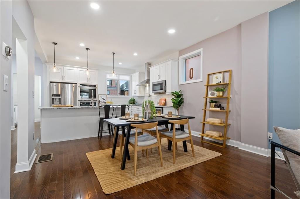5531 Columbo Street Pittsburgh, PA 15206 - Photo 7 of 34 a view of a dining room with furniture and wooden floor