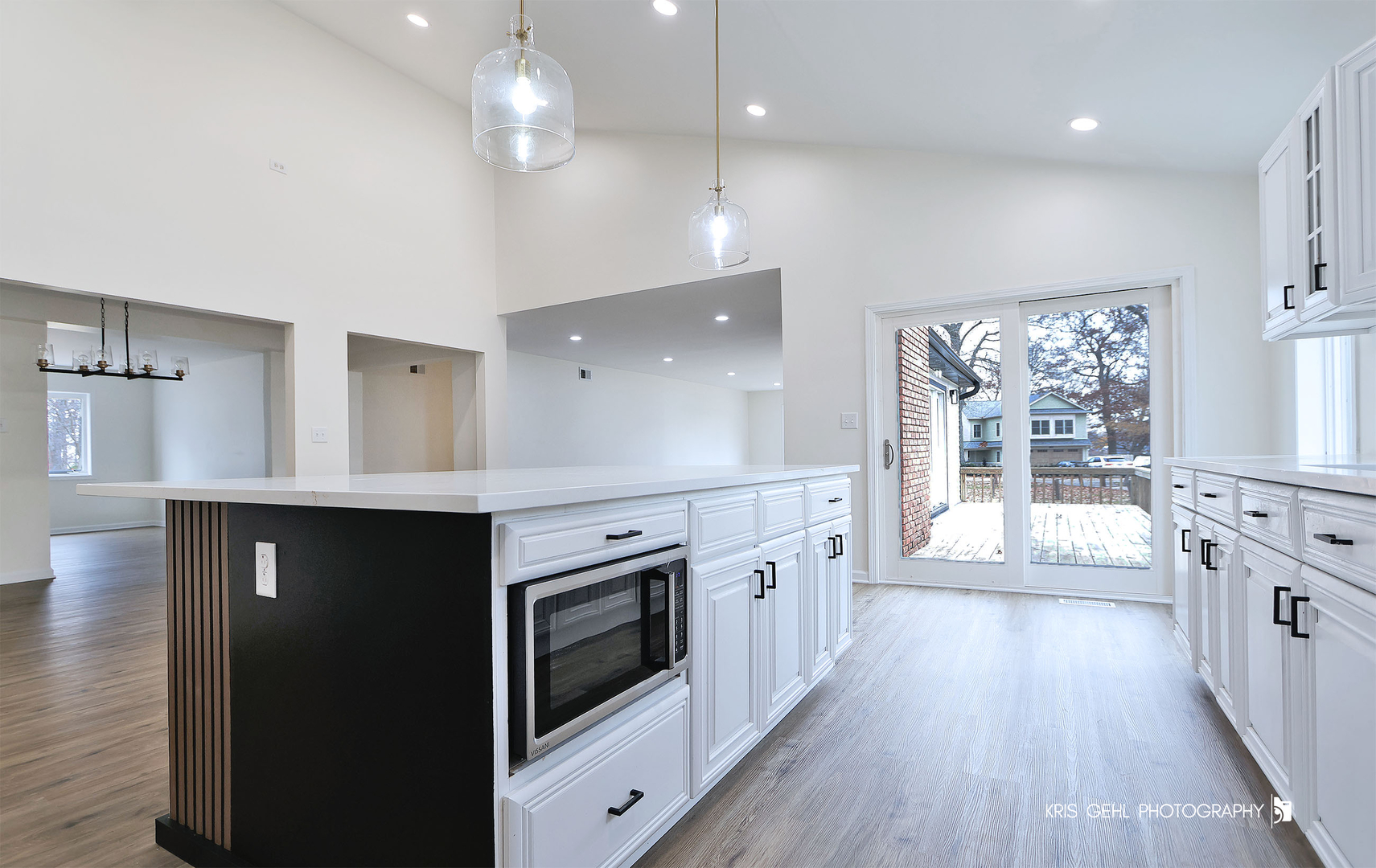 18653 West Willow Point Road Grayslake, IL 60030 - Photo 13 of 49 a large kitchen with cabinets wooden floor and stainless steel appliances