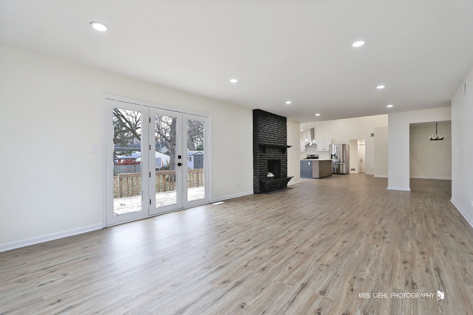 18653 West Willow Point Road Grayslake, IL 60030 - Photo 17 of 49 a view of a big room with wooden floor and windows