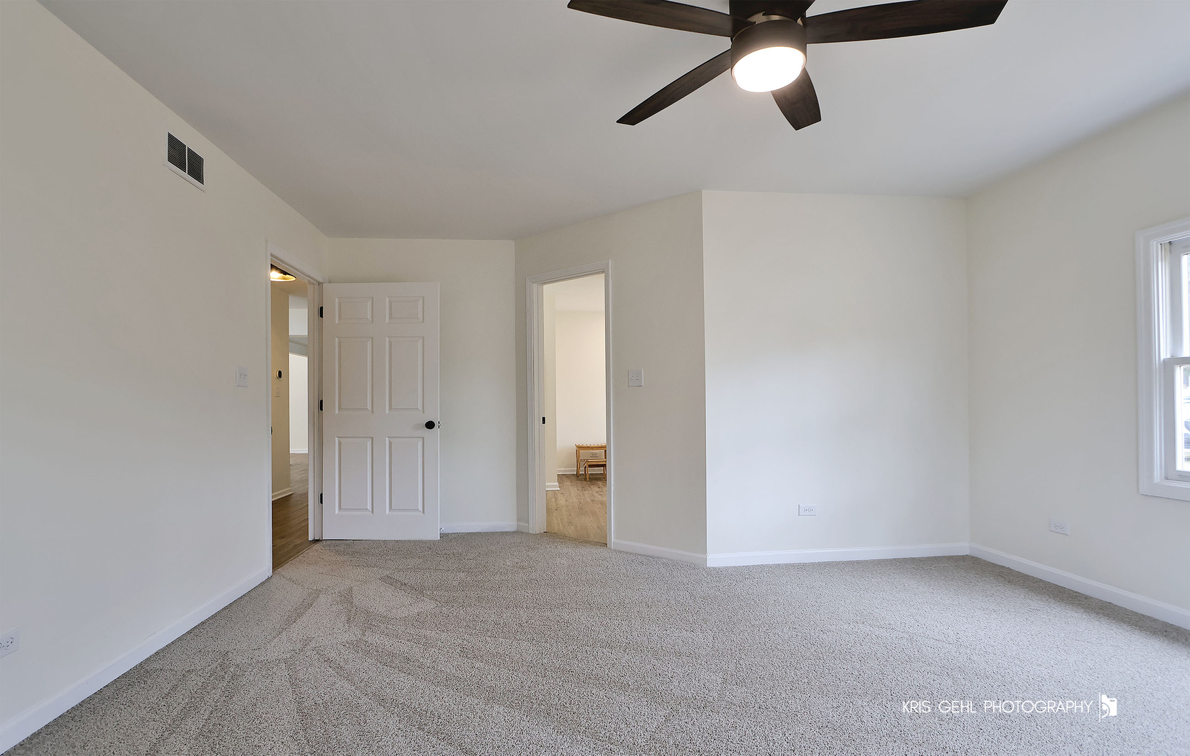 18653 West Willow Point Road Grayslake, IL 60030 - Photo 20 of 49 a view of a room with a ceiling fan and window