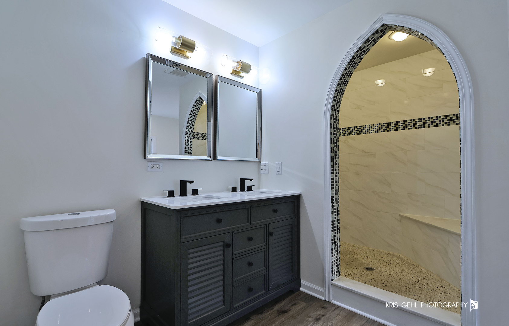 18653 West Willow Point Road Grayslake, IL 60030 - Photo 21 of 49 a bathroom with a toilet sink and mirror