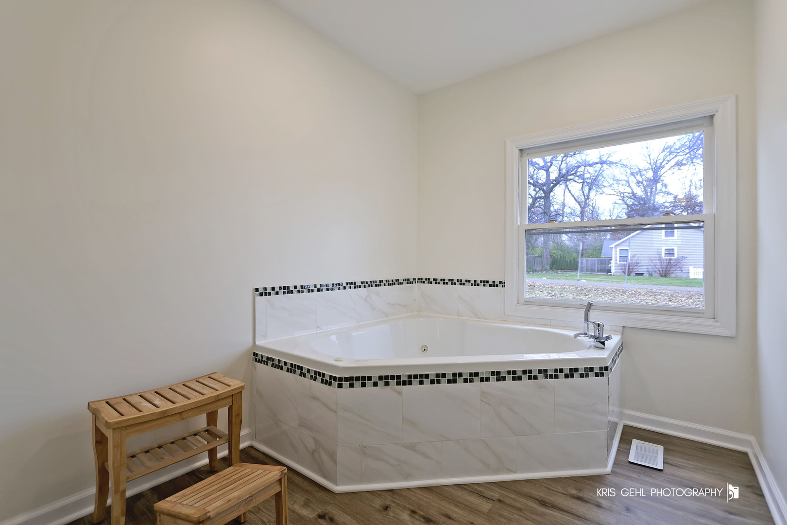 18653 West Willow Point Road Grayslake, IL 60030 - Photo 23 of 49 a room with a table chair and wooden floor