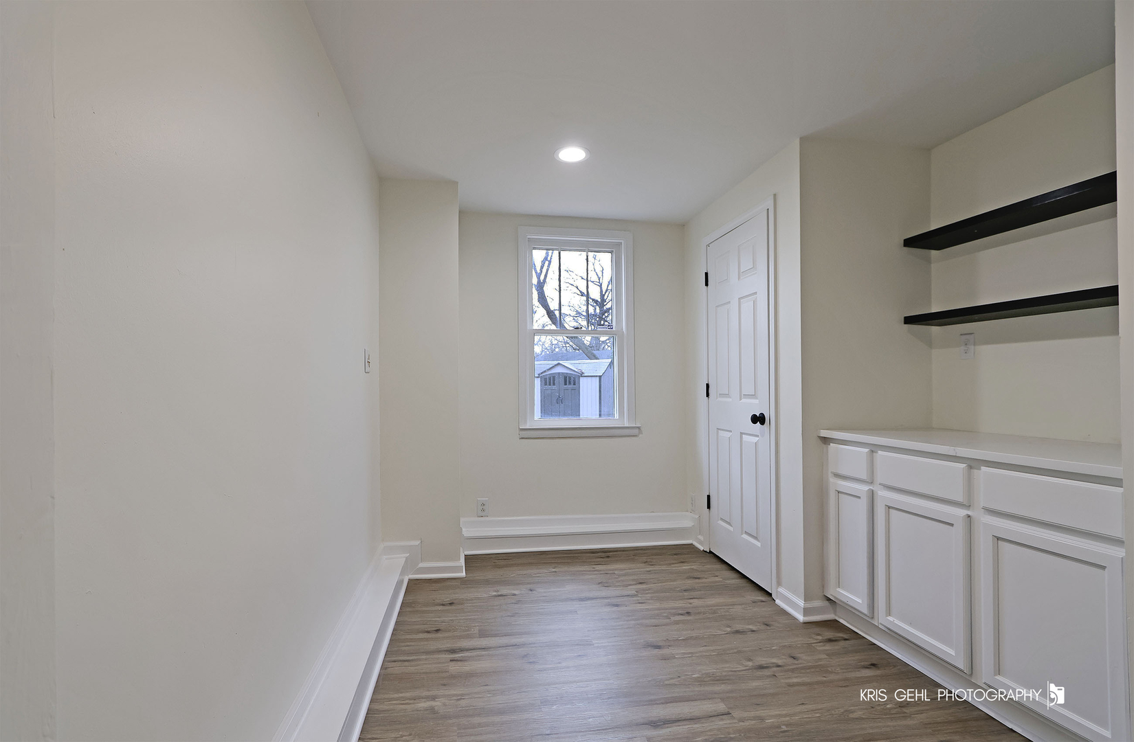 18653 West Willow Point Road Grayslake, IL 60030 - Photo 28 of 49 a view of an empty room with wooden floor and a window