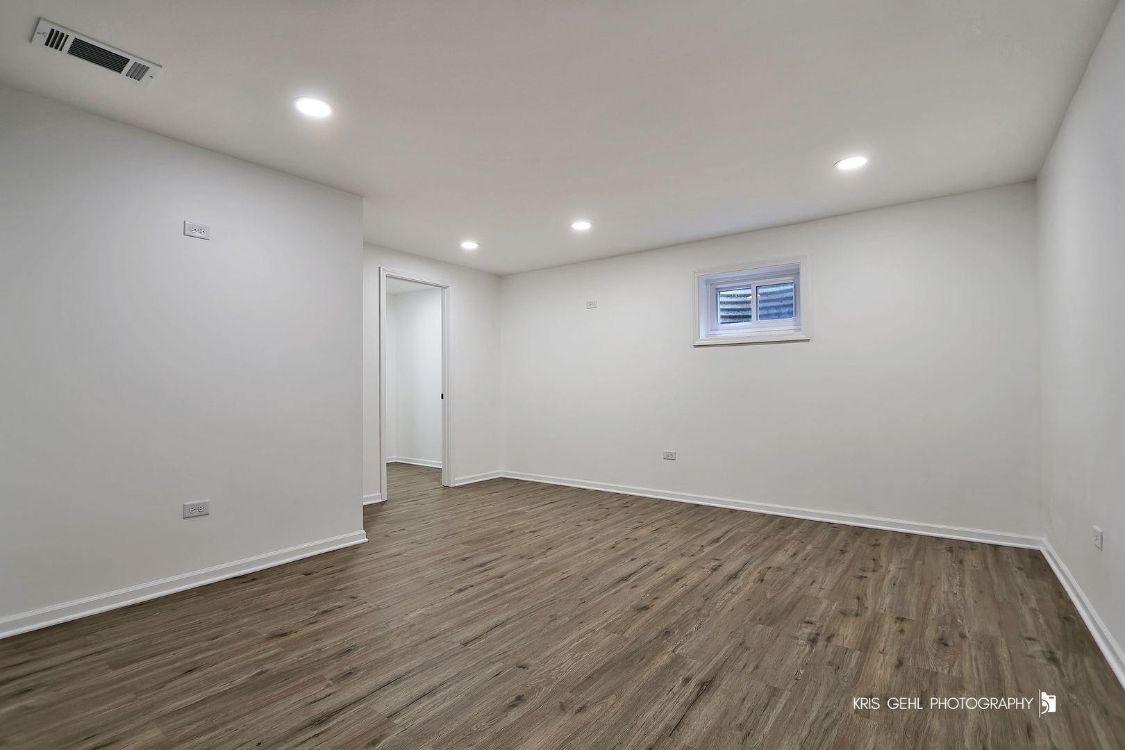 18653 West Willow Point Road Grayslake, IL 60030 - Photo 31 of 49 an empty room with wooden floor and windows
