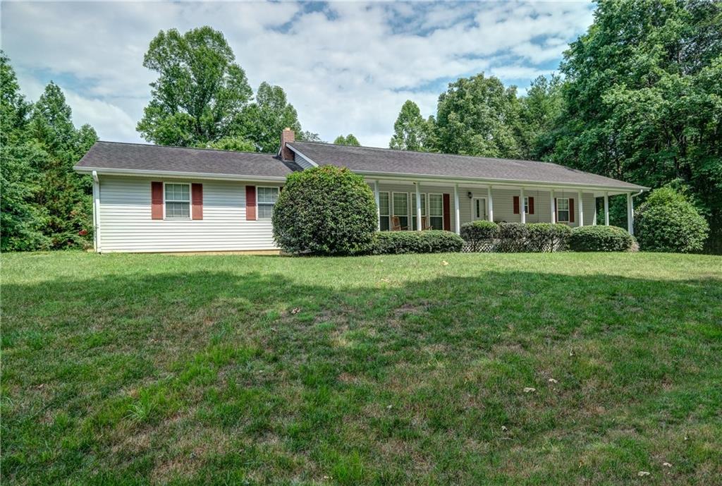 741 Damascus Circle Blue Ridge, GA 30513 - Photo 1 of 1 a front view of house with yard and green space