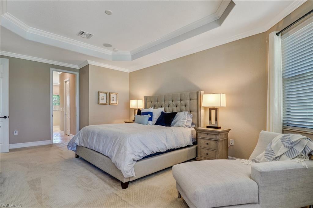 9902 Corso Bello Drive Naples, FL 34113 - Photo 24 of 45 a bedroom with two beds and large window