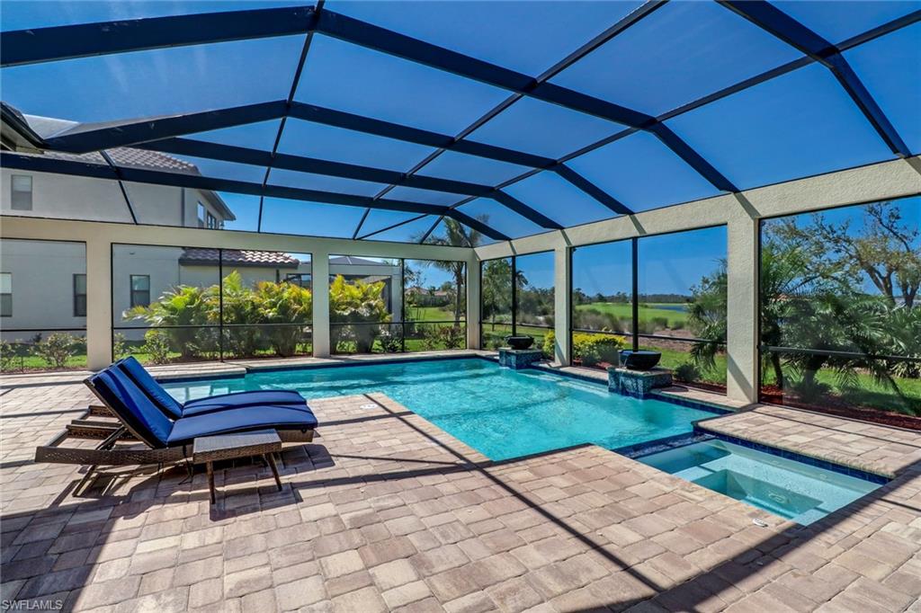 9902 Corso Bello Drive Naples, FL 34113 - Photo 39 of 45 a view of a backyard with sitting area