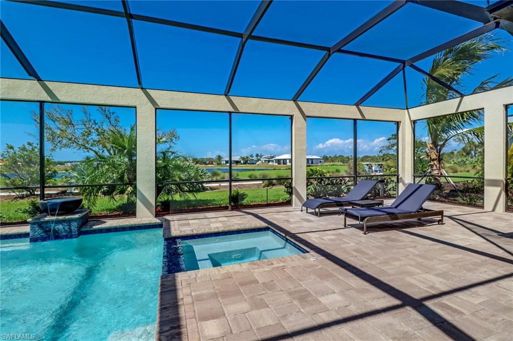 9902 Corso Bello Drive Naples, FL 34113 - Photo 40 of 45 a view of a backyard with sitting area
