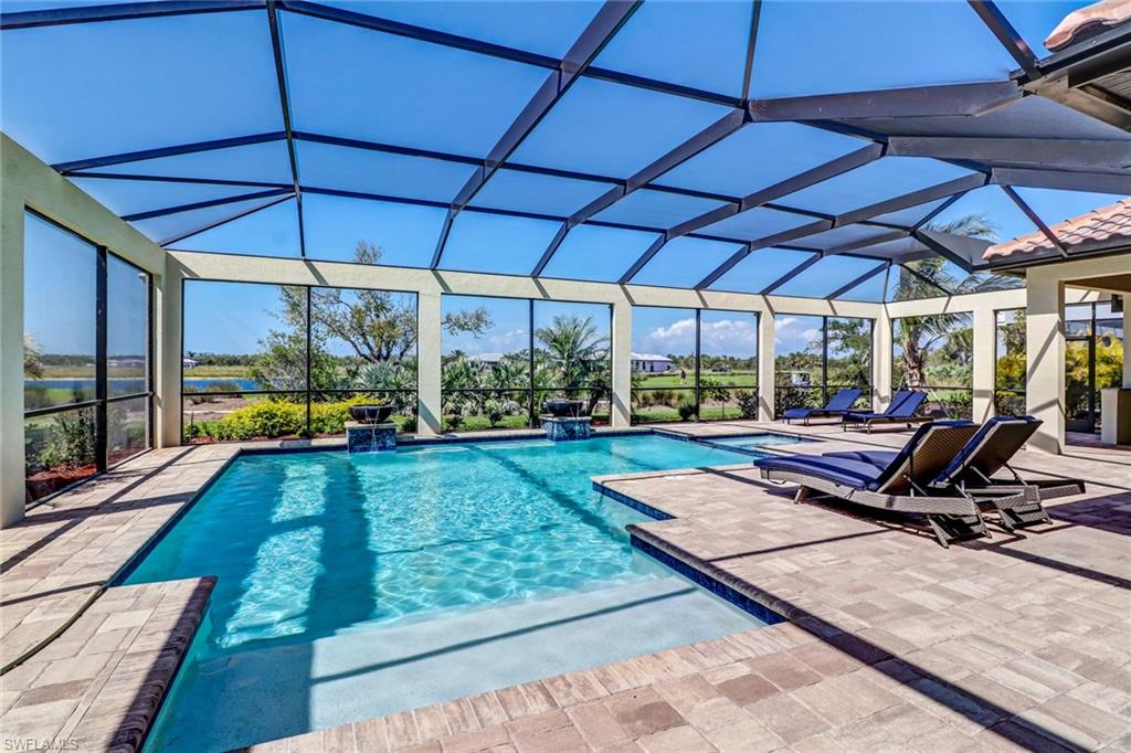 9902 Corso Bello Drive Naples, FL 34113 - Photo 41 of 45 a view of a backyard with sitting area