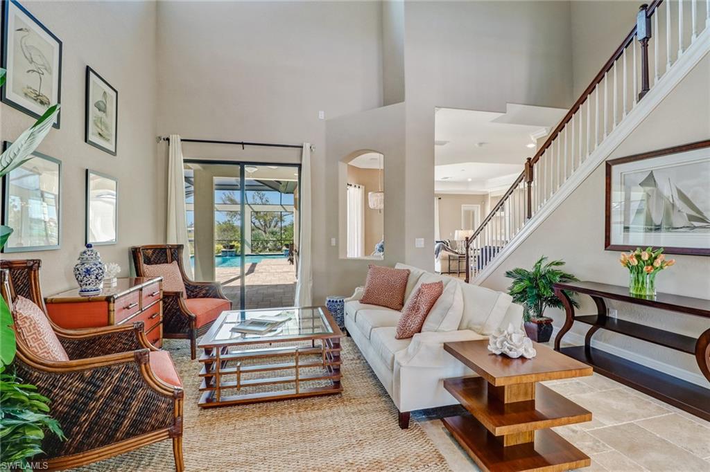 9902 Corso Bello Drive Naples, FL 34113 - Photo 6 of 45 a living room with furniture or couch and a potted plant