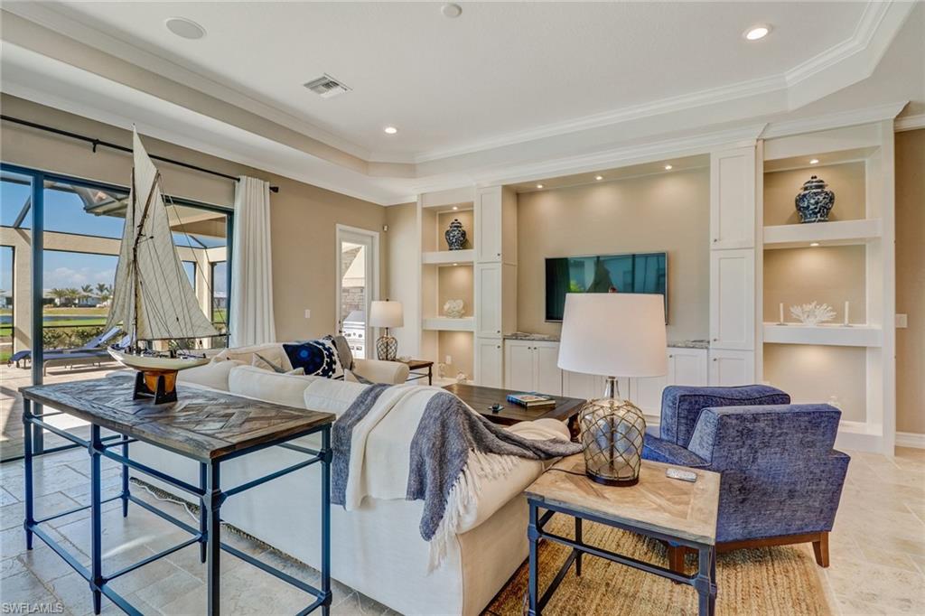 9902 Corso Bello Drive Naples, FL 34113 - Photo 10 of 45 a living room with furniture and a window