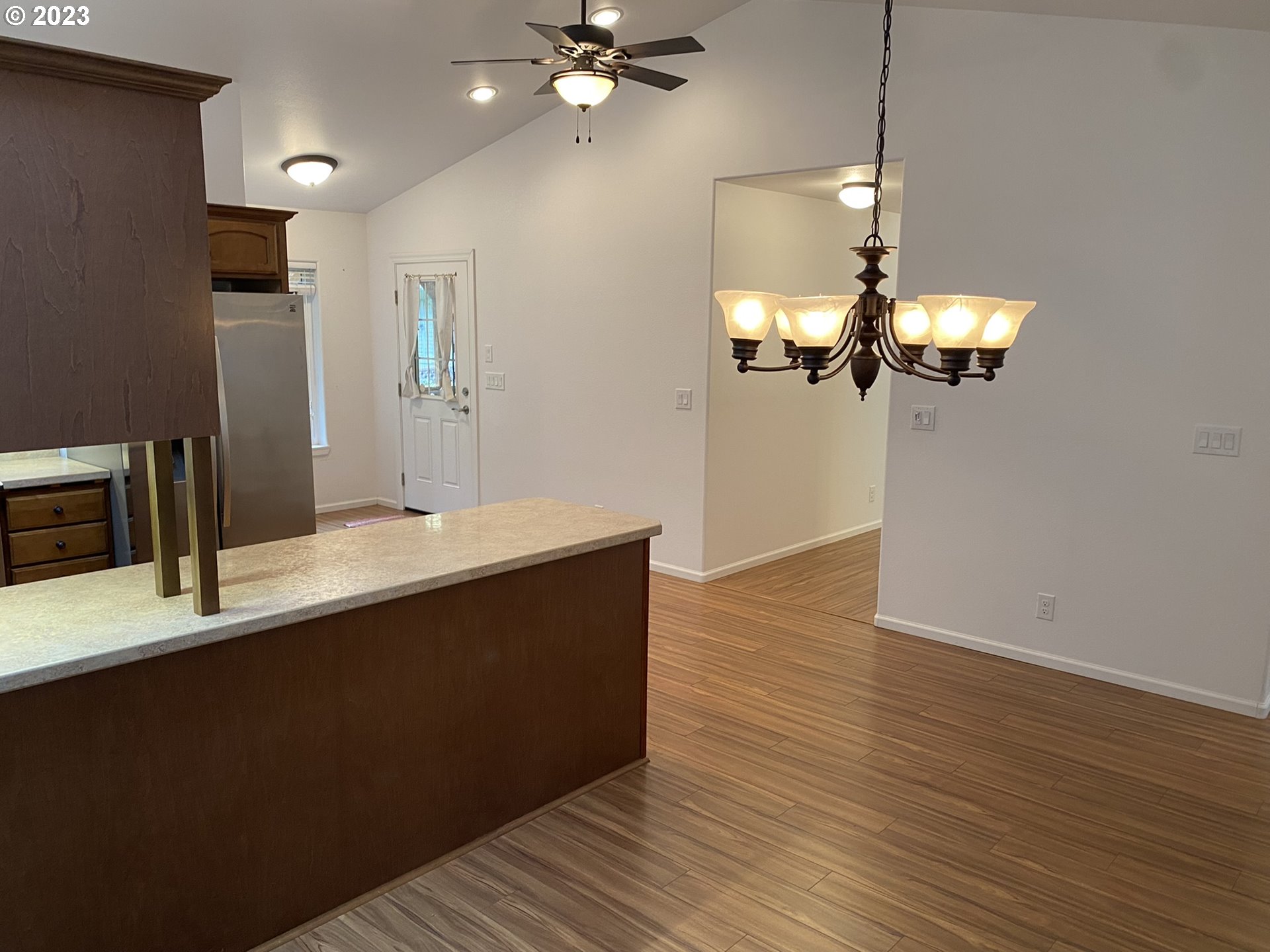 4863 Darlings Loop Florence, OR 97439 - Photo 14 of 47 a view of a kitchen with a sink and chandelier