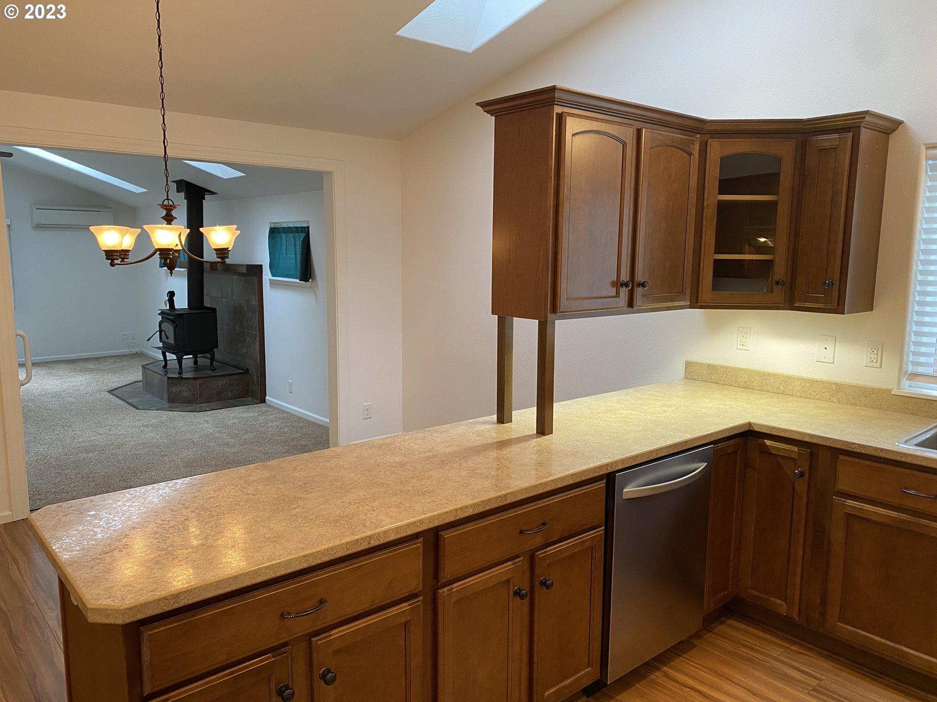 4863 Darlings Loop Florence, OR 97439 - Photo 17 of 47 a kitchen with a sink and a mirror