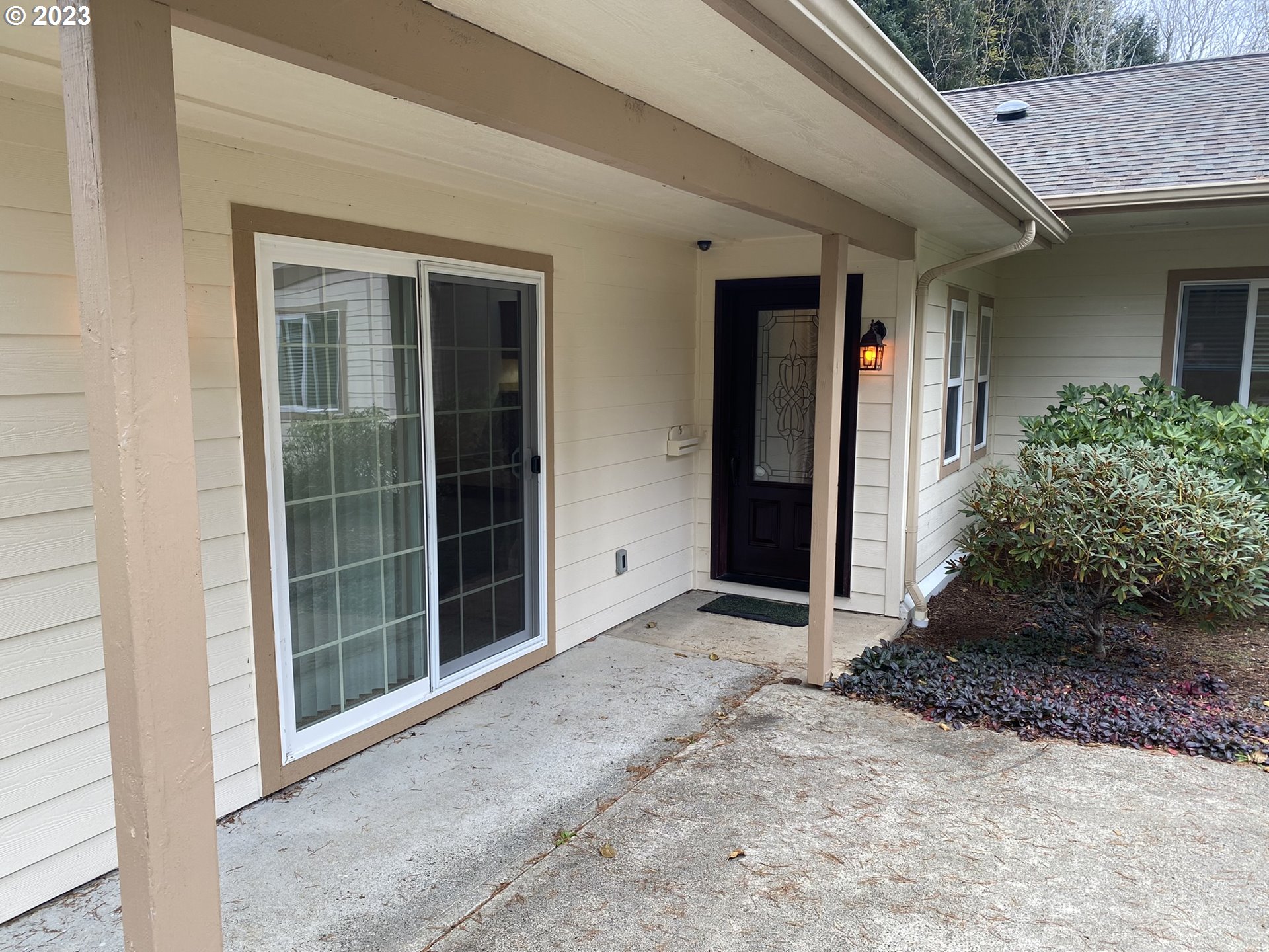 4863 Darlings Loop Florence, OR 97439 - Photo 2 of 47 a view of front door and yard