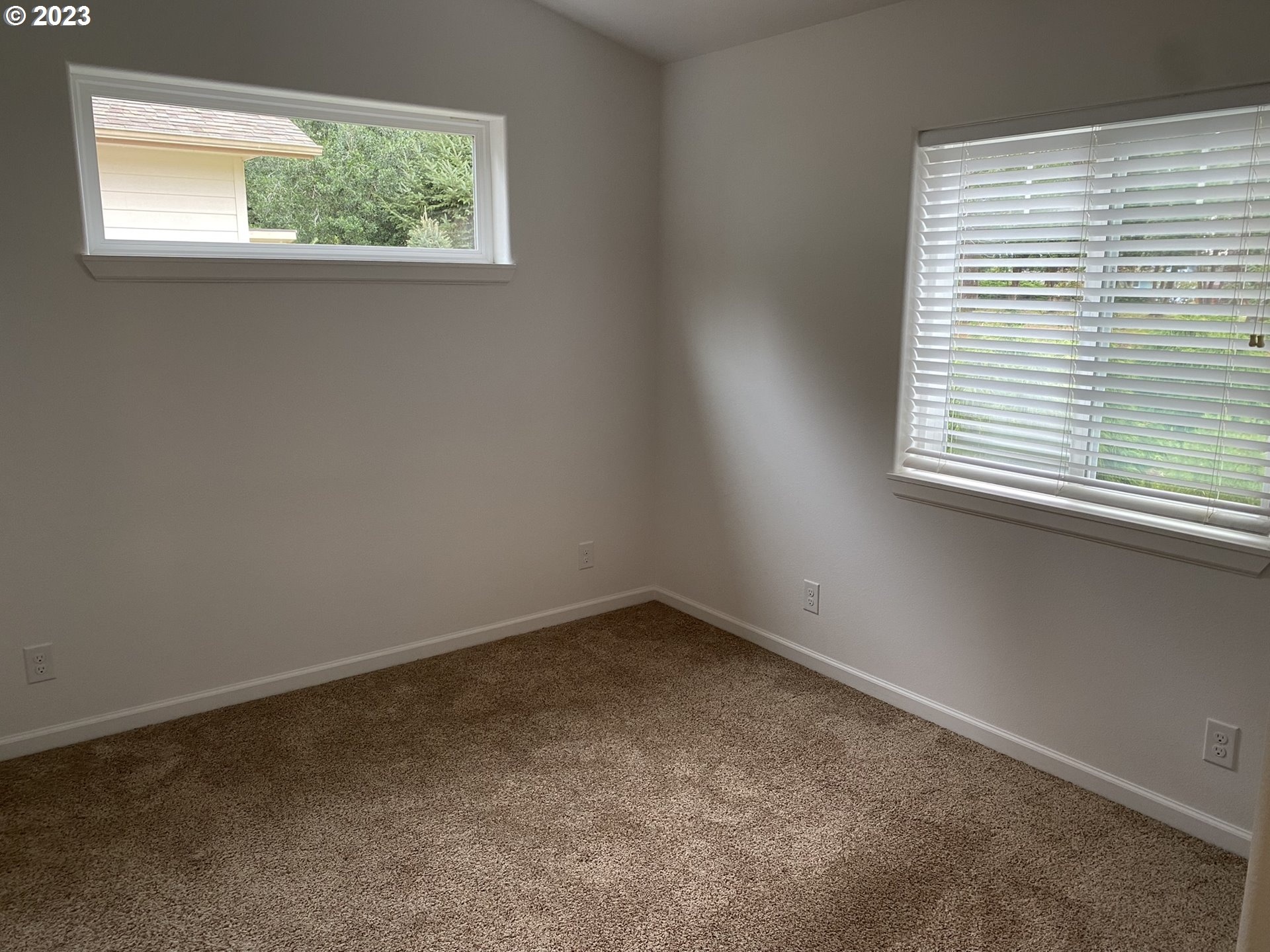 4863 Darlings Loop Florence, OR 97439 - Photo 22 of 47 an empty room with a window