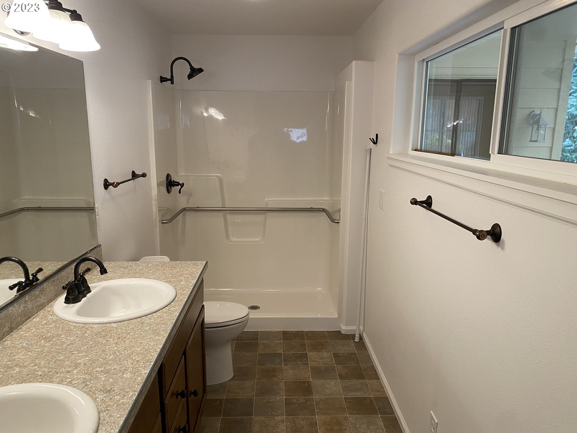 4863 Darlings Loop Florence, OR 97439 - Photo 27 of 47 a bathroom with a sink vanity granite and toilet