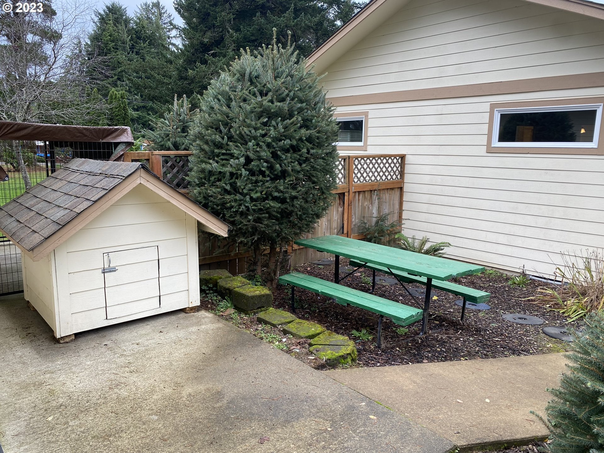 4863 Darlings Loop Florence, OR 97439 - Photo 37 of 47 a view of backyard with a deck and furniture
