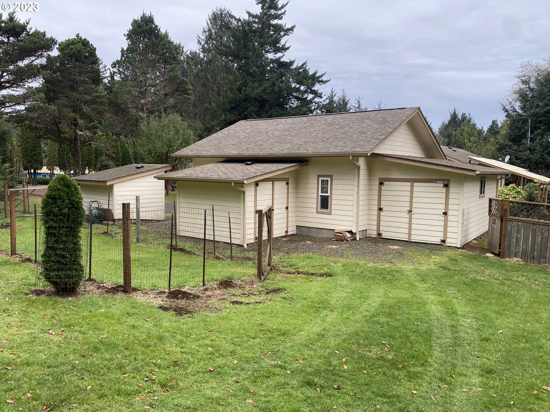 4863 Darlings Loop Florence, OR 97439 - Photo 40 of 47 a view of a house with a backyard