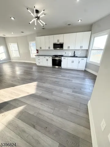 a view of kitchen with wooden floor