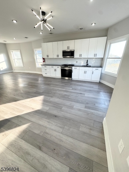 a view of kitchen with wooden floor