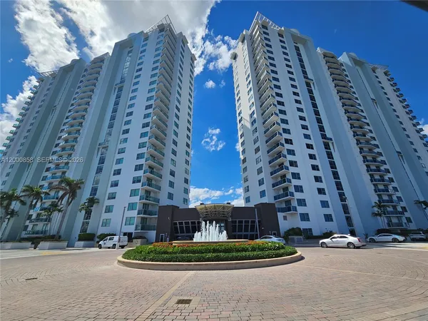 a tall building sitting next to a yard