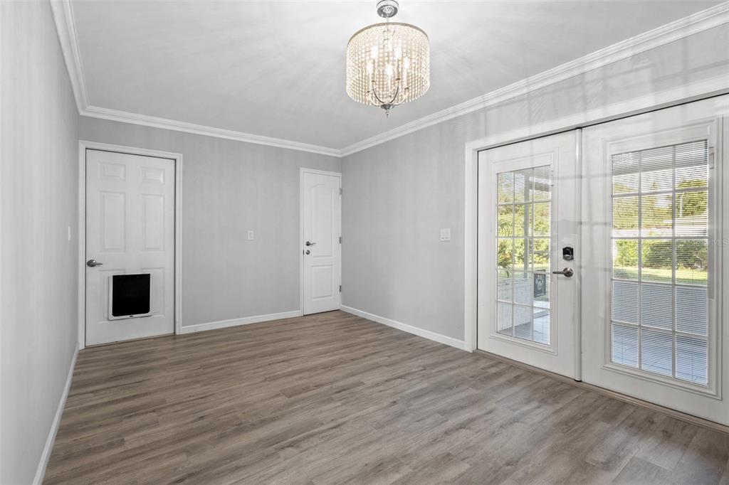 2033 Little Neck Road Clearwater, FL 33755 - Photo 23 of 39 Dining area with neutral paint colors and natural light
