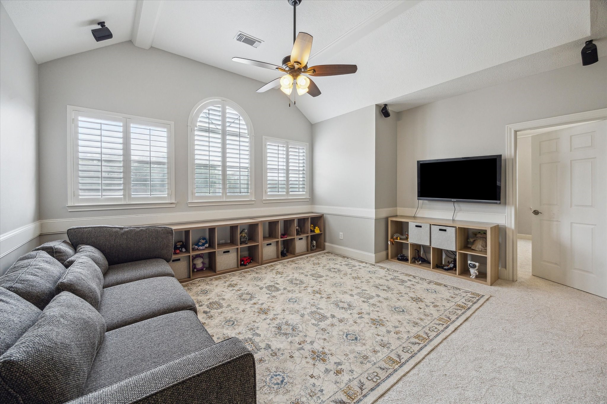 13627 Ashley Run Houston, TX 77077 - Photo 16 of 28 a living room with furniture and a flat screen tv